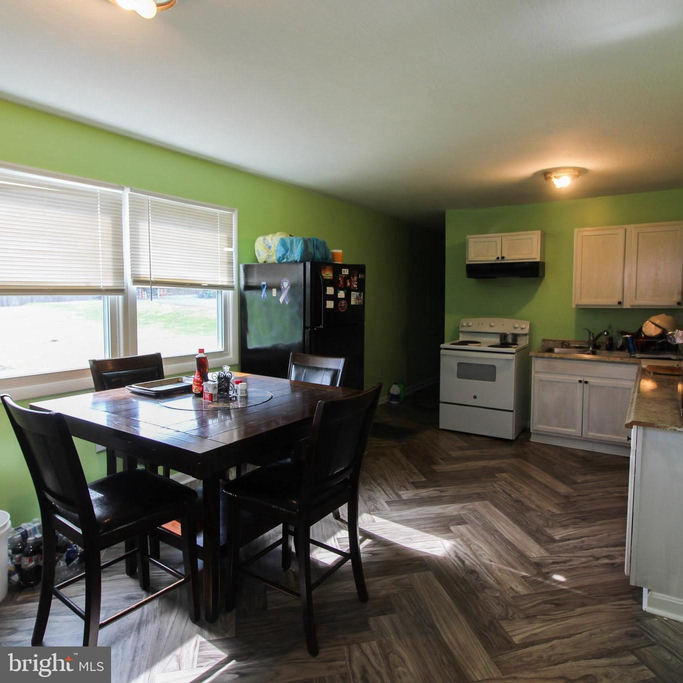 2212 Swartz Road Woodstock, VA 22664 - Photo 8 of 21 a view of a dining room with furniture and window