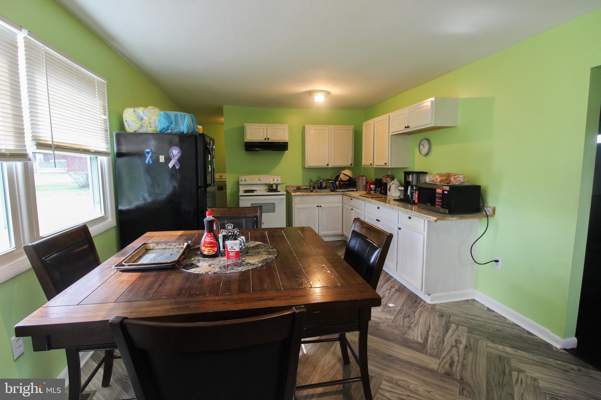 2212 Swartz Road Woodstock, VA 22664 - Photo 9 of 21 a view of a dining room with furniture and wooden floor
