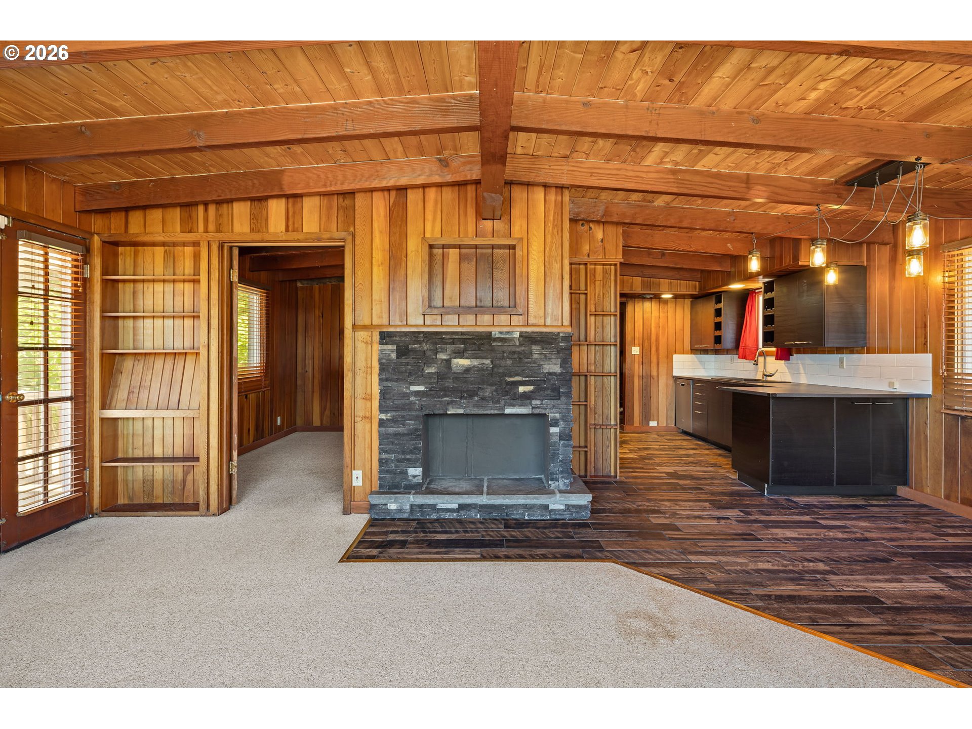 88481 1st Avenue Florence, OR 97439 - Photo 6 of 43 a living room with a fireplace furniture and a kitchen