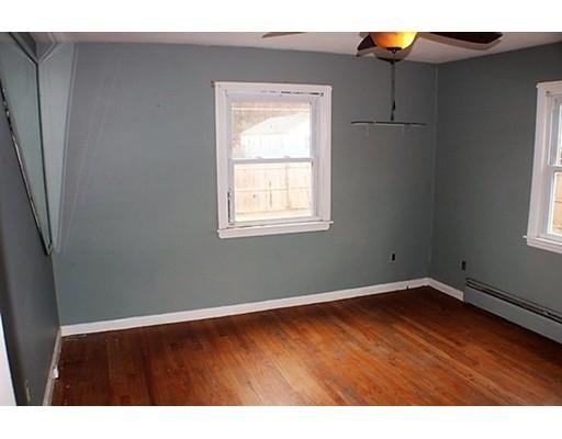 98 Bretton Road Springfield, MA 01119 - Photo 15 of 25 a view of an empty room with wooden floor and a window