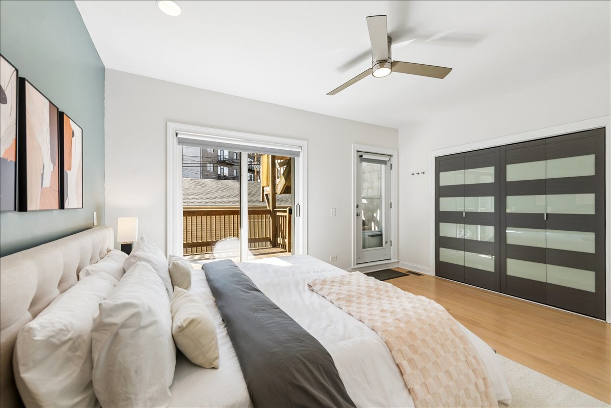 2838 North Damen Avenue, Unit 1 Chicago, IL 60618 - Photo 11 of 25 a bedroom with a bed and a large window