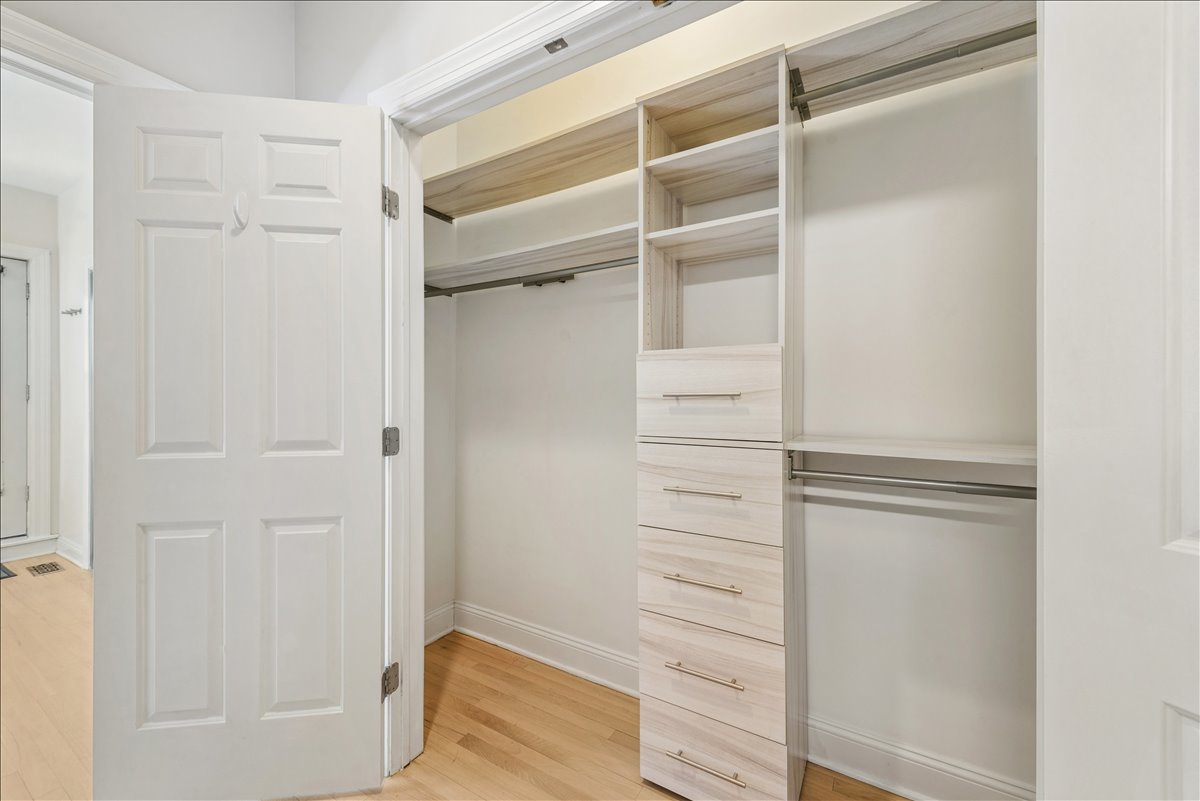 2838 North Damen Avenue, Unit 1 Chicago, IL 60618 - Photo 13 of 25 a view of walk in closet with empty racks
