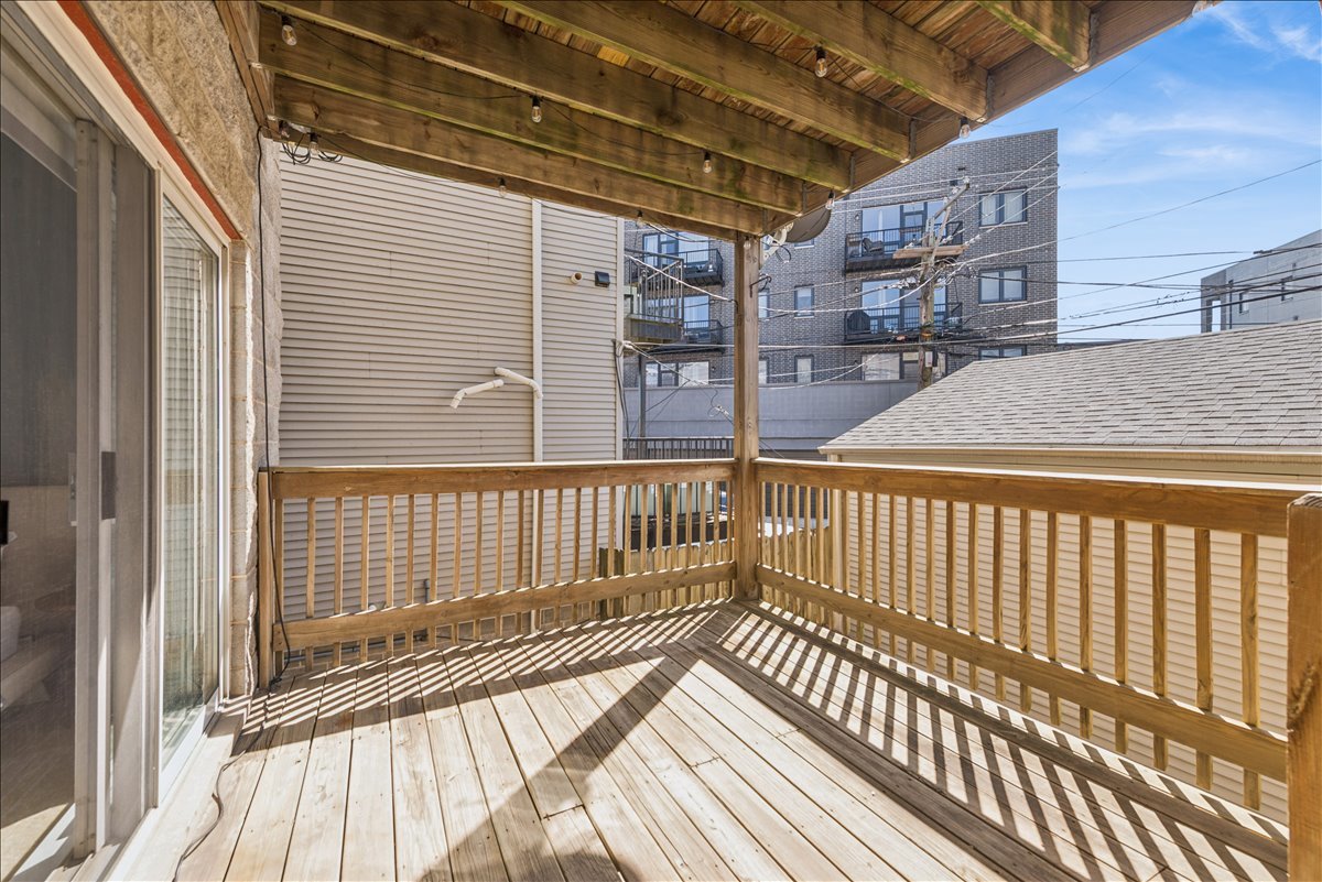 2838 North Damen Avenue, Unit 1 Chicago, IL 60618 - Photo 14 of 25 a view of a balcony with wooden floor