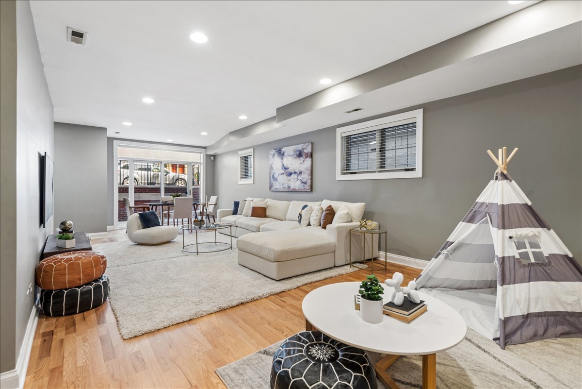 2838 North Damen Avenue, Unit 1 Chicago, IL 60618 - Photo 15 of 25 a living room with furniture and a table