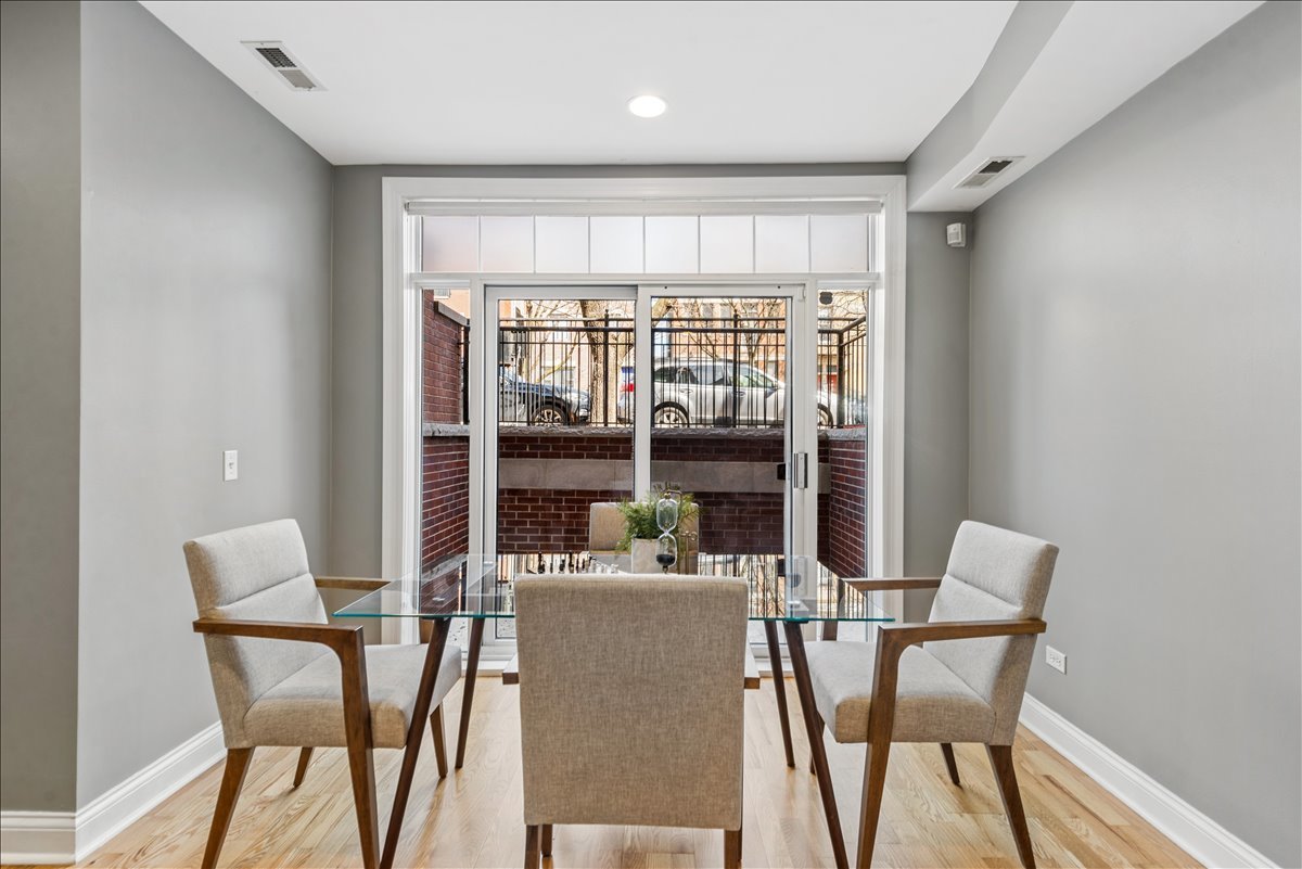 2838 North Damen Avenue, Unit 1 Chicago, IL 60618 - Photo 17 of 25 a dining room with furniture and window