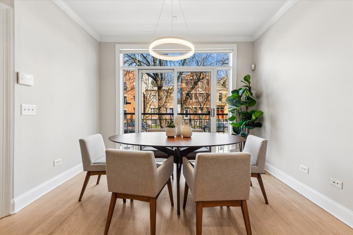 2838 North Damen Avenue, Unit 1 Chicago, IL 60618 - Photo 4 of 25 a view of a dining room with furniture window and wooden floor