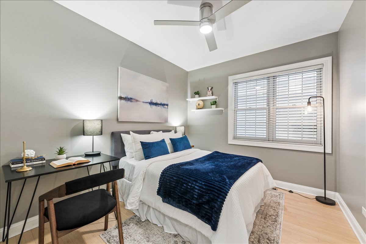 2838 North Damen Avenue, Unit 1 Chicago, IL 60618 - Photo 7 of 25 a bedroom with a bed and a window