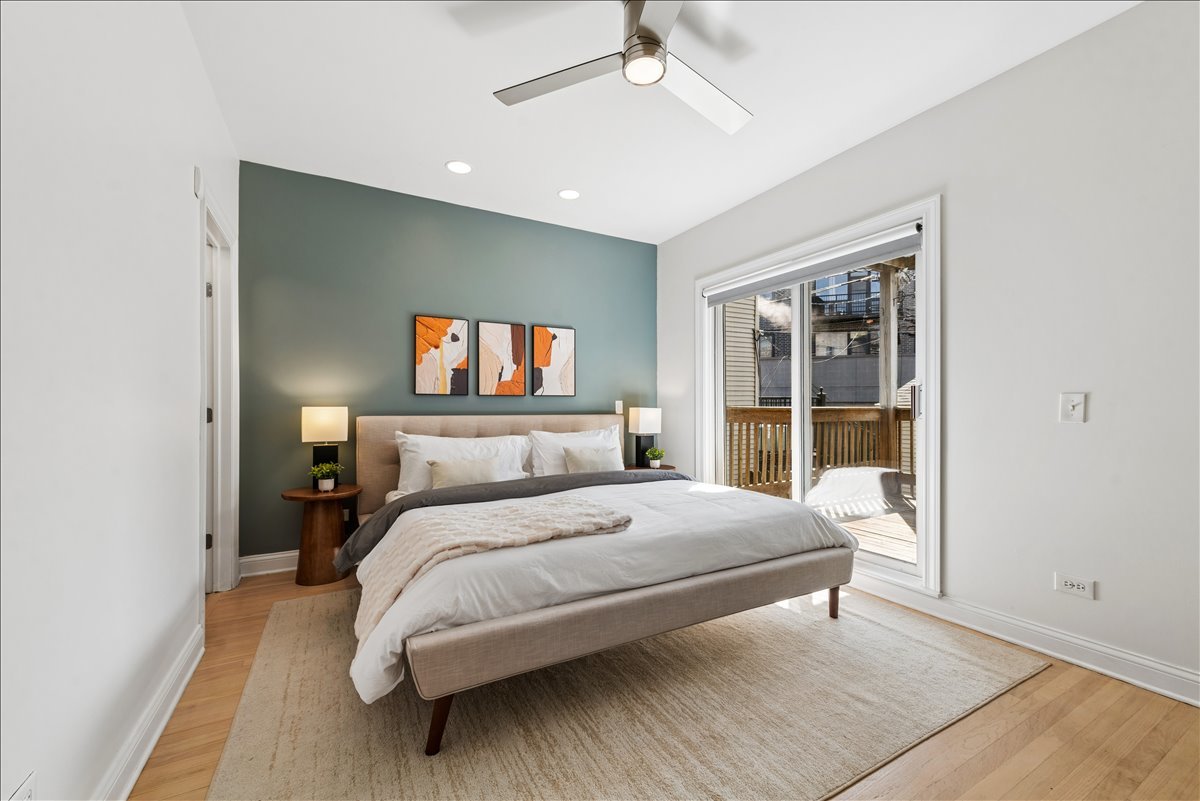 2838 North Damen Avenue, Unit 1 Chicago, IL 60618 - Photo 9 of 25 a bedroom with a large bed and a window