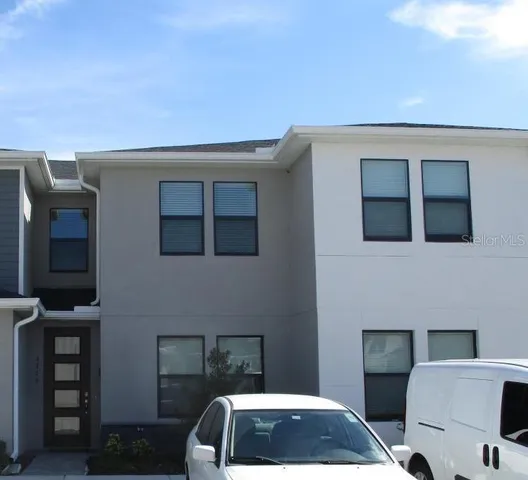 a backyard of a house with seating space