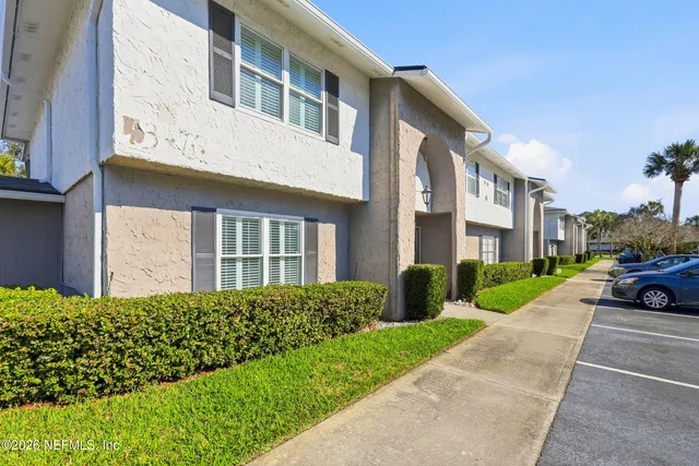 a view of multiple house with a yard