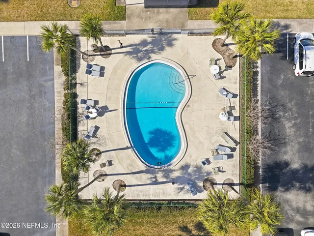 a bathroom with a sink mirror and vanity