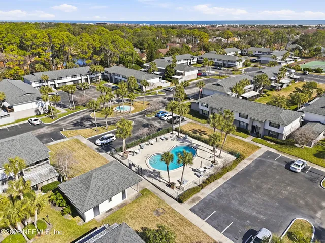 an aerial view of residential houses with outdoor space