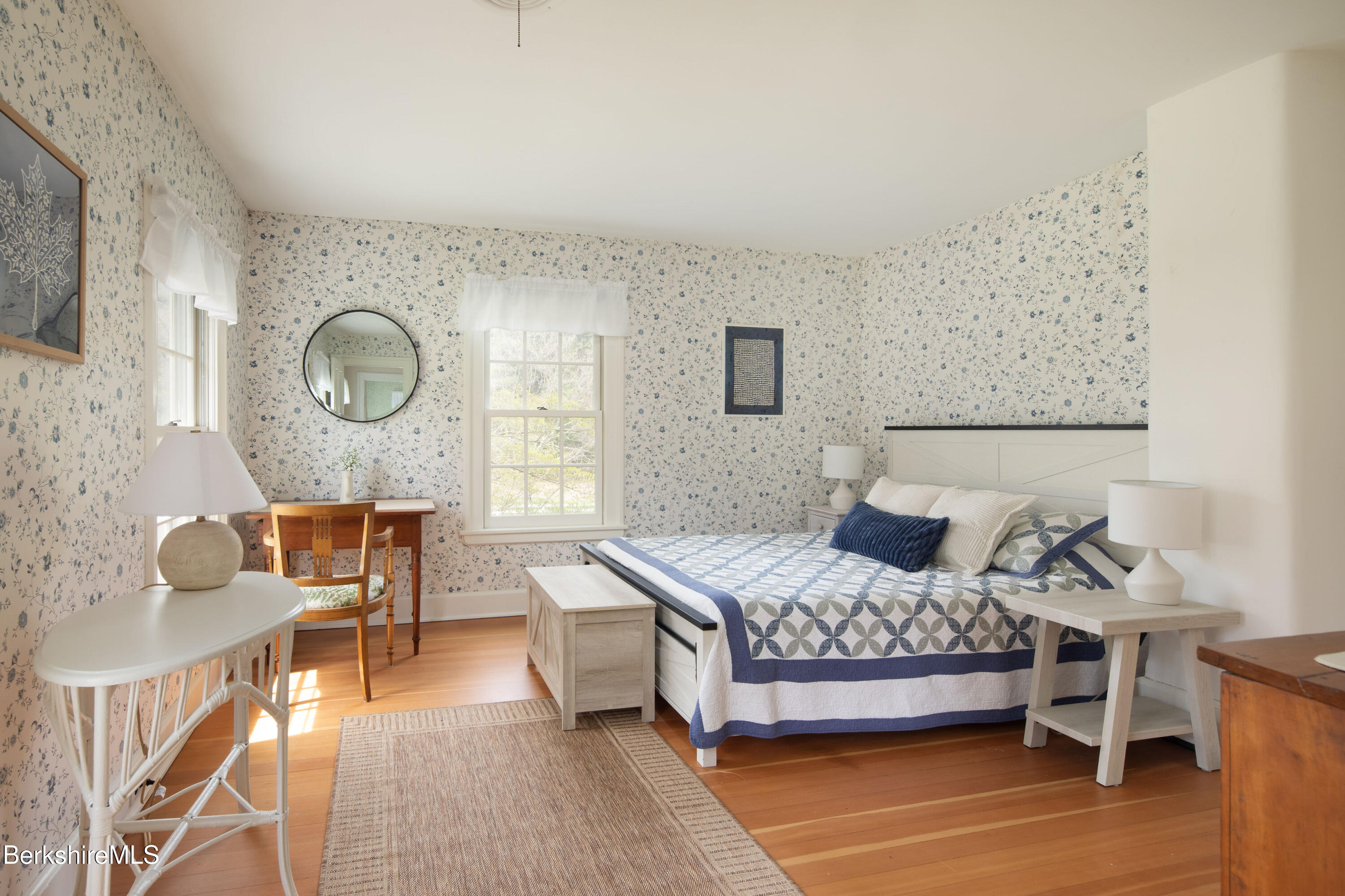 1430 Salisbury Road Sheffield, MA 01257 - Photo 17 of 29 a bedroom with a bed a dresser with chair and couch
