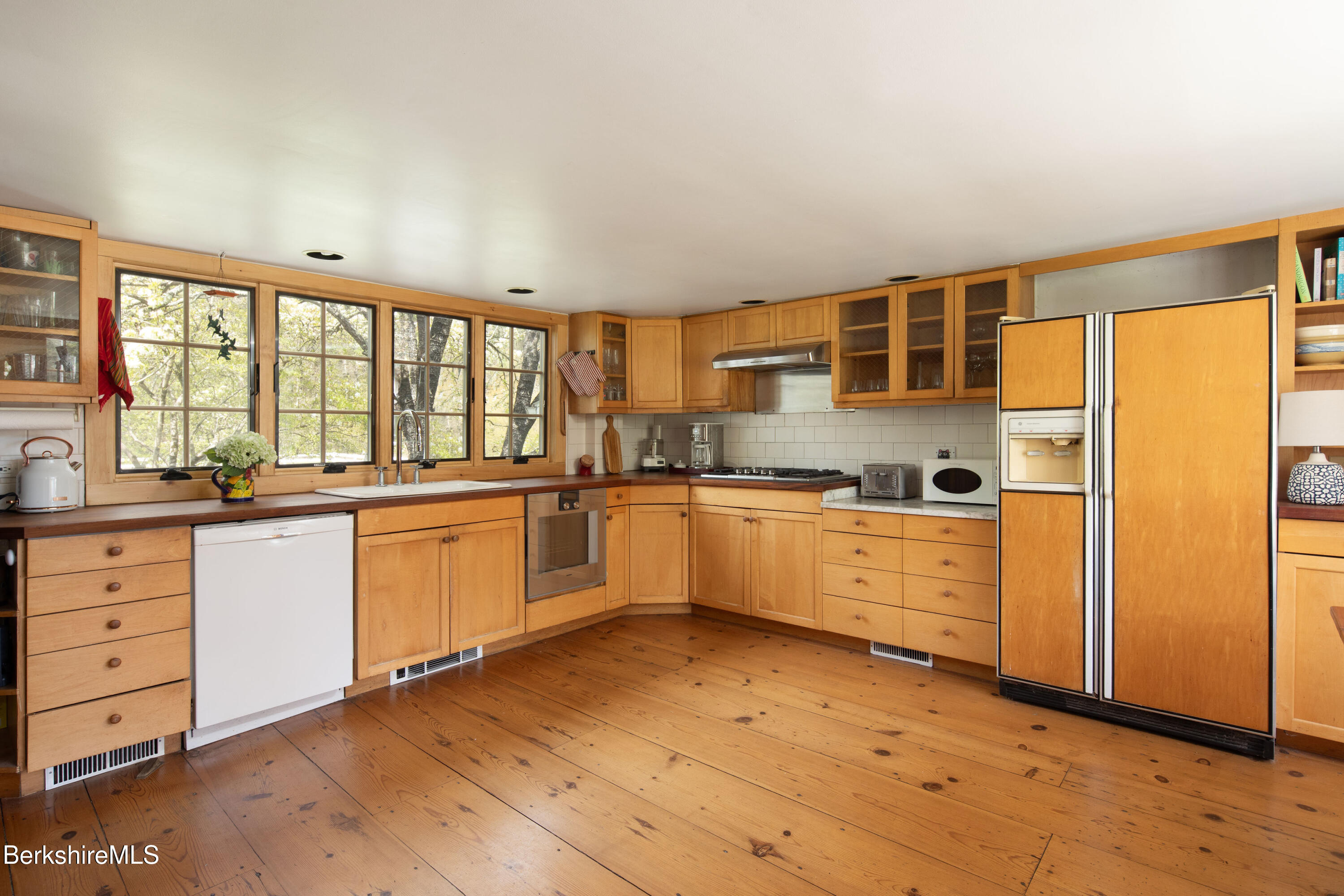 1430 Salisbury Road Sheffield, MA 01257 - Photo 3 of 29 a large kitchen with granite countertop a large window and a sink