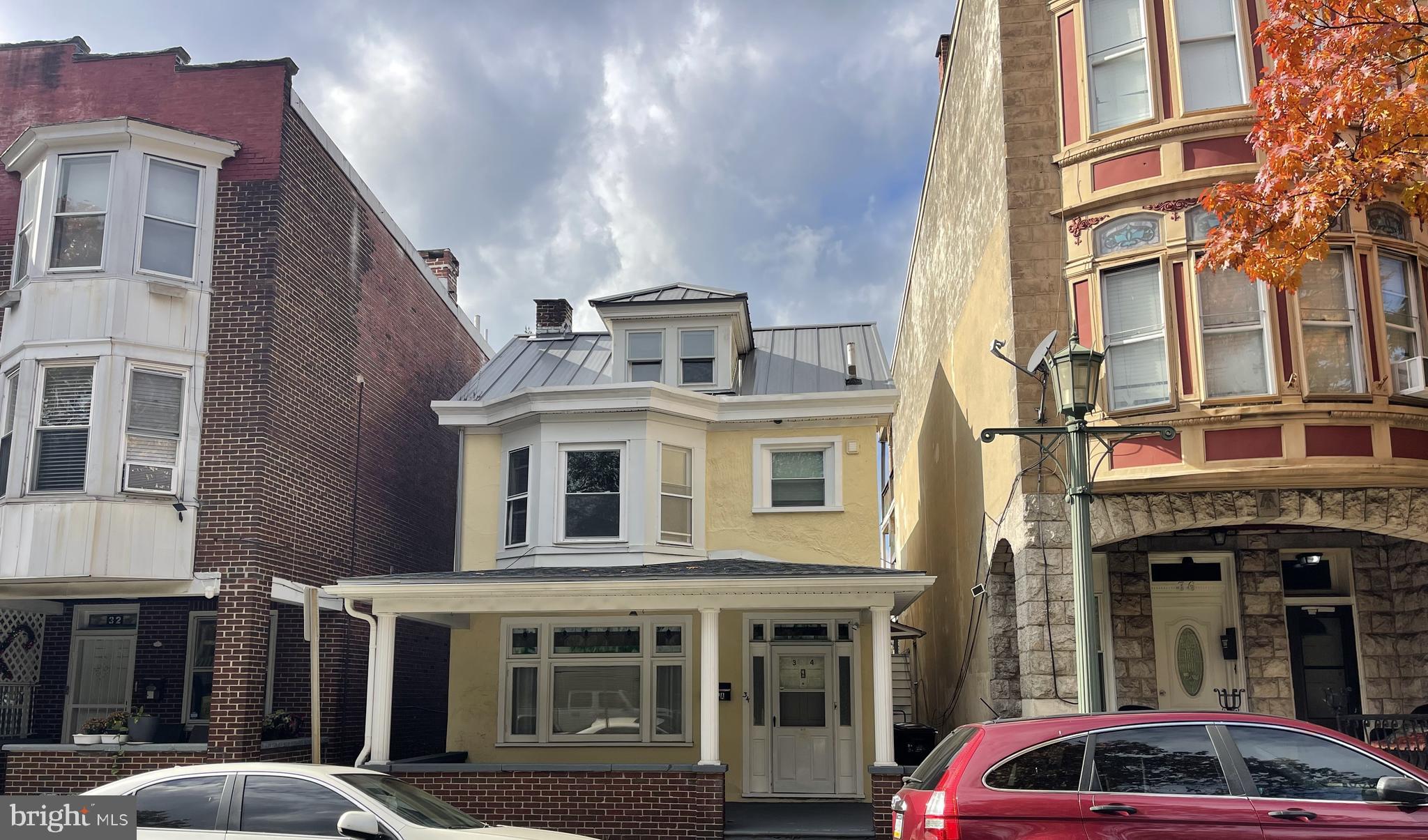 a front view of a building with parking space