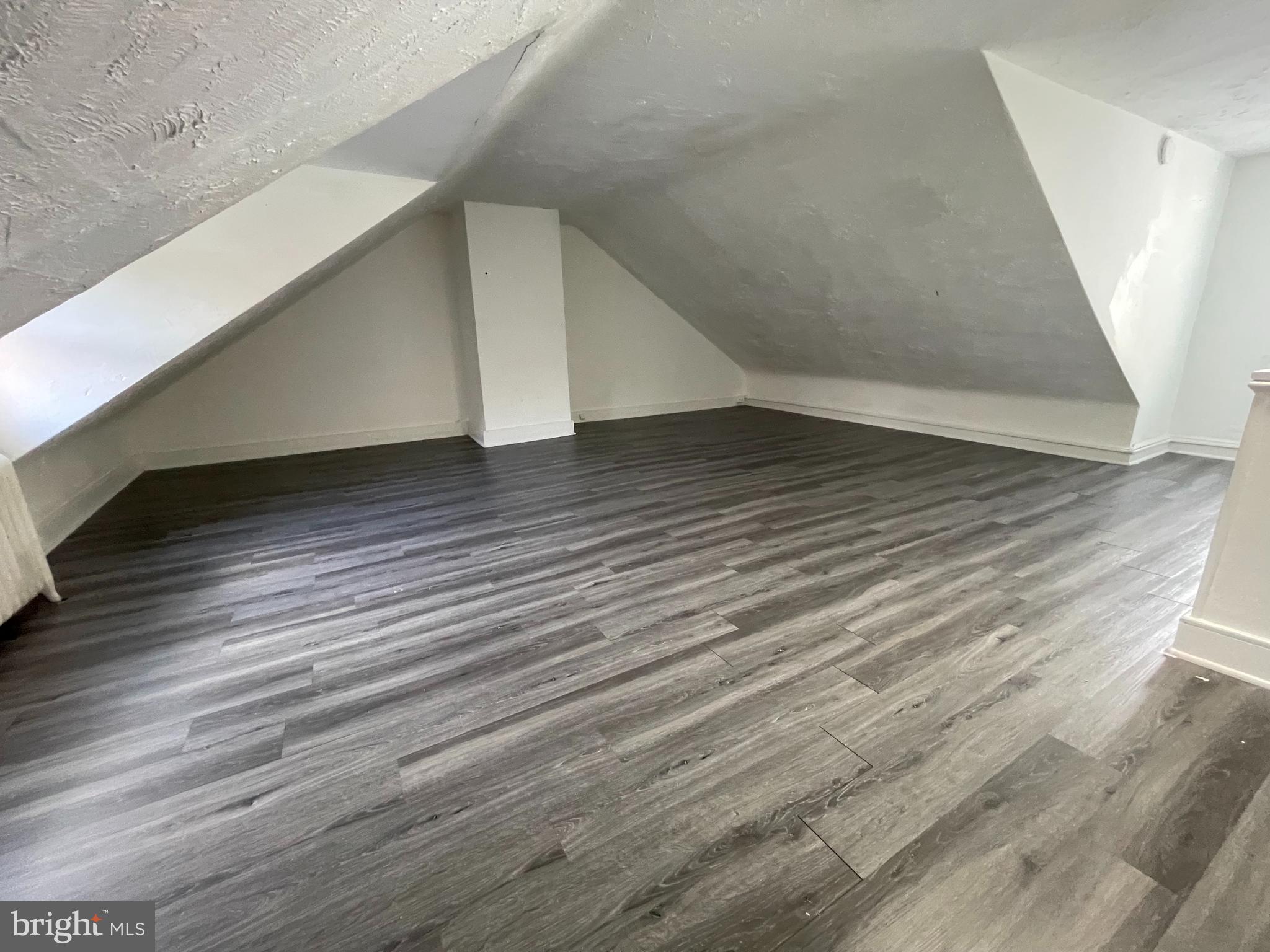 34 North 11th Street Reading, PA 19601 - Photo 11 of 15 a view of a hallway with wooden floor