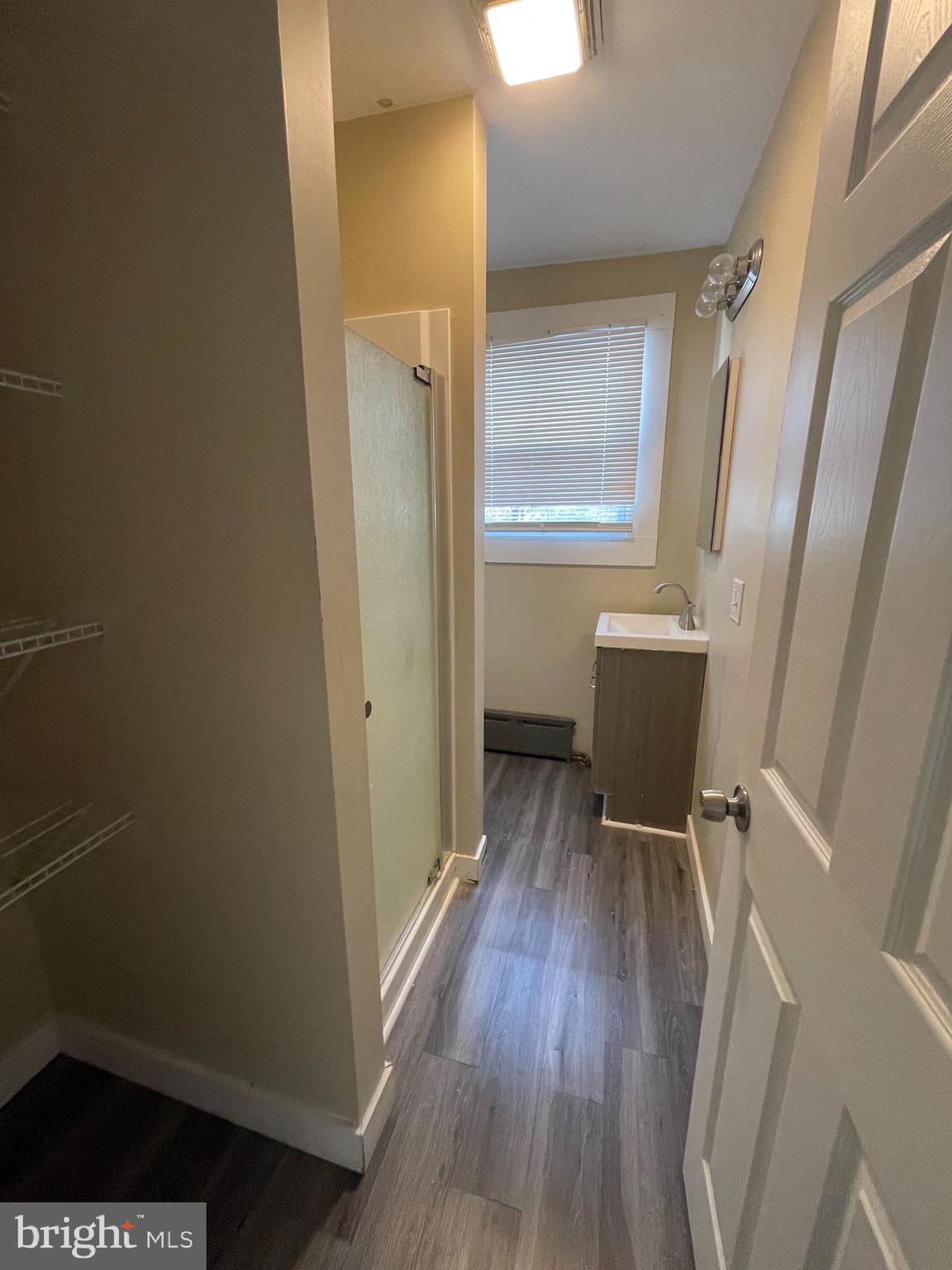 34 North 11th Street Reading, PA 19601 - Photo 12 of 15 a view of wooden floor and chair in a room