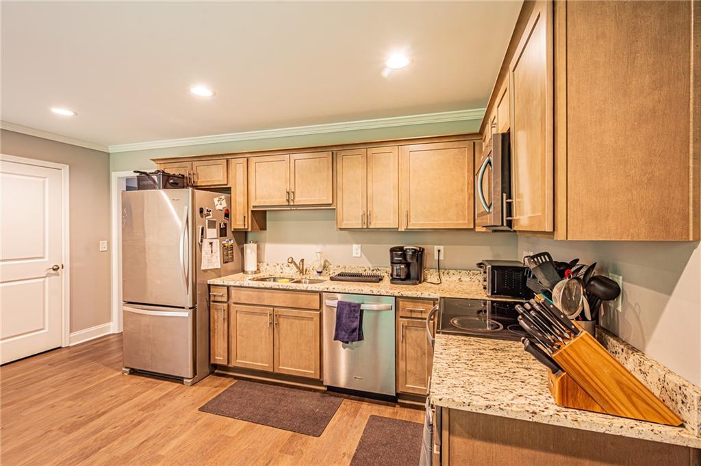 502 Wimpy Mill Road Dahlonega, GA 30533 - Photo 11 of 30 a kitchen with a refrigerator a stove a sink and a microwave