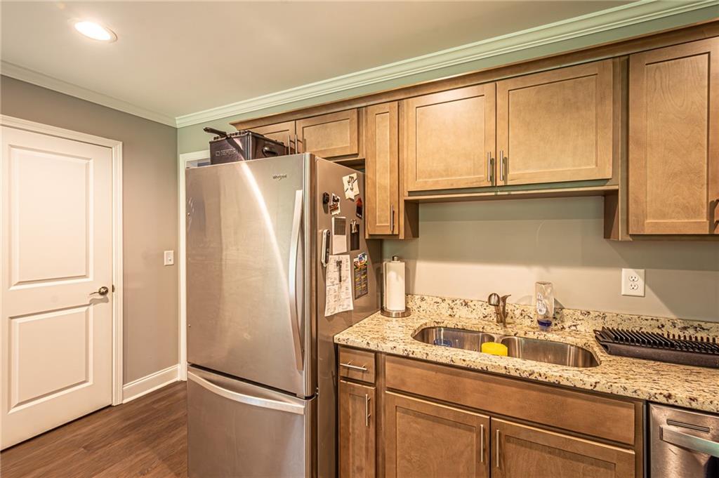 502 Wimpy Mill Road Dahlonega, GA 30533 - Photo 13 of 30 a kitchen with a refrigerator and a sink