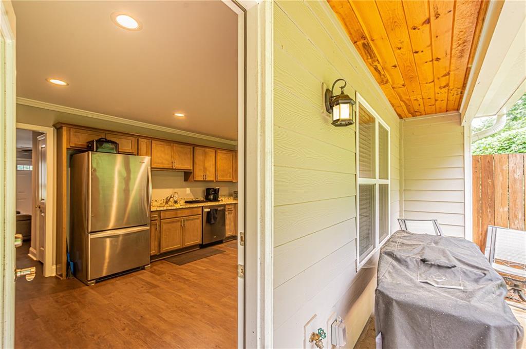 502 Wimpy Mill Road Dahlonega, GA 30533 - Photo 15 of 30 a kitchen with stainless steel appliances a refrigerator and a stove top oven