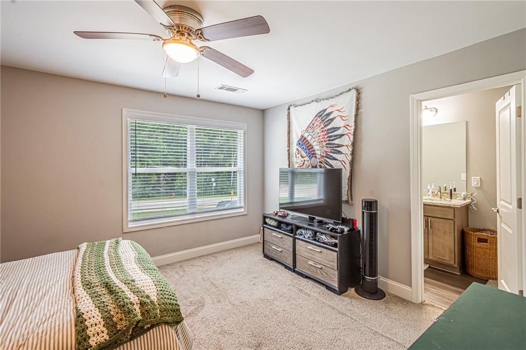 502 Wimpy Mill Road Dahlonega, GA 30533 - Photo 16 of 30 a bedroom with furniture and a window