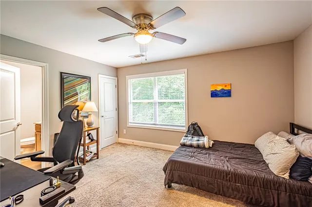 a bedroom with bed and window