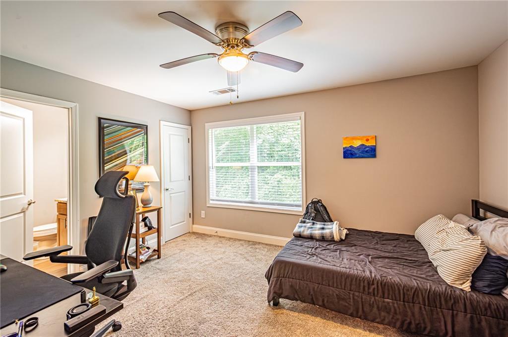 502 Wimpy Mill Road Dahlonega, GA 30533 - Photo 24 of 30 a bedroom with bed and window