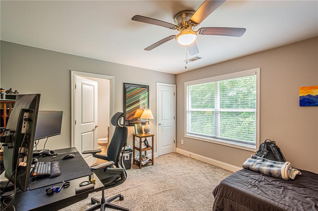 502 Wimpy Mill Road Dahlonega, GA 30533 - Photo 25 of 30 a room with gym equipment and windows