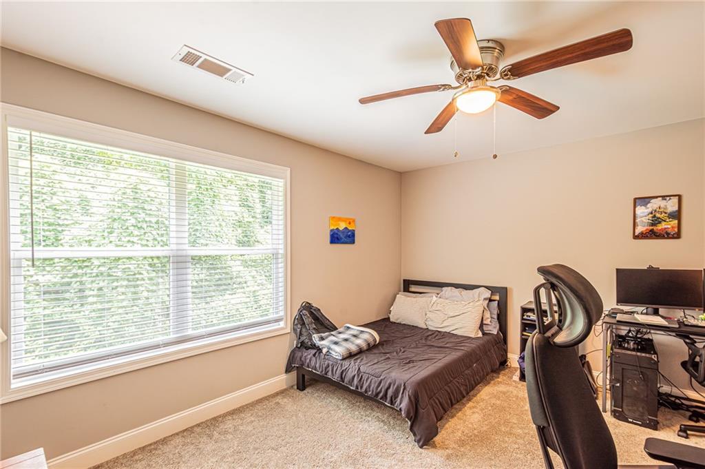 502 Wimpy Mill Road Dahlonega, GA 30533 - Photo 28 of 30 a bedroom with a bed and a window
