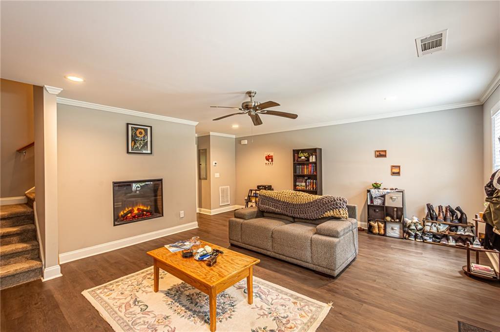 502 Wimpy Mill Road Dahlonega, GA 30533 - Photo 3 of 30 a living room with furniture and a fireplace