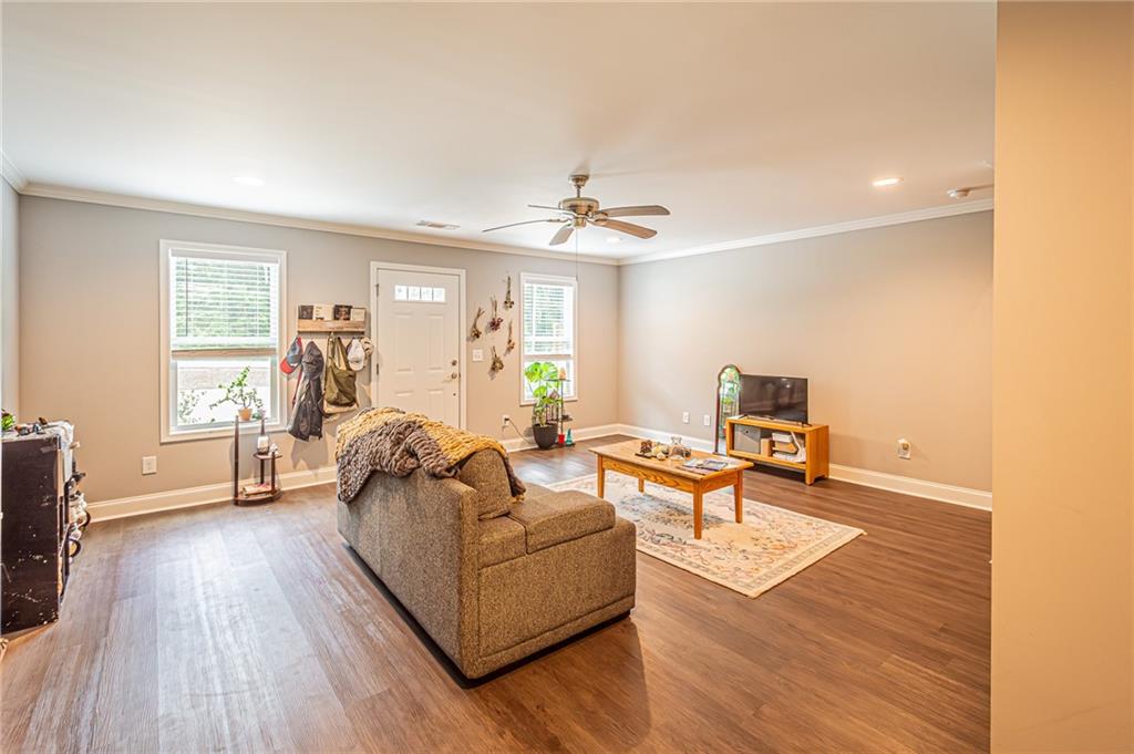 502 Wimpy Mill Road Dahlonega, GA 30533 - Photo 5 of 30 a living room with furniture and a wooden floor