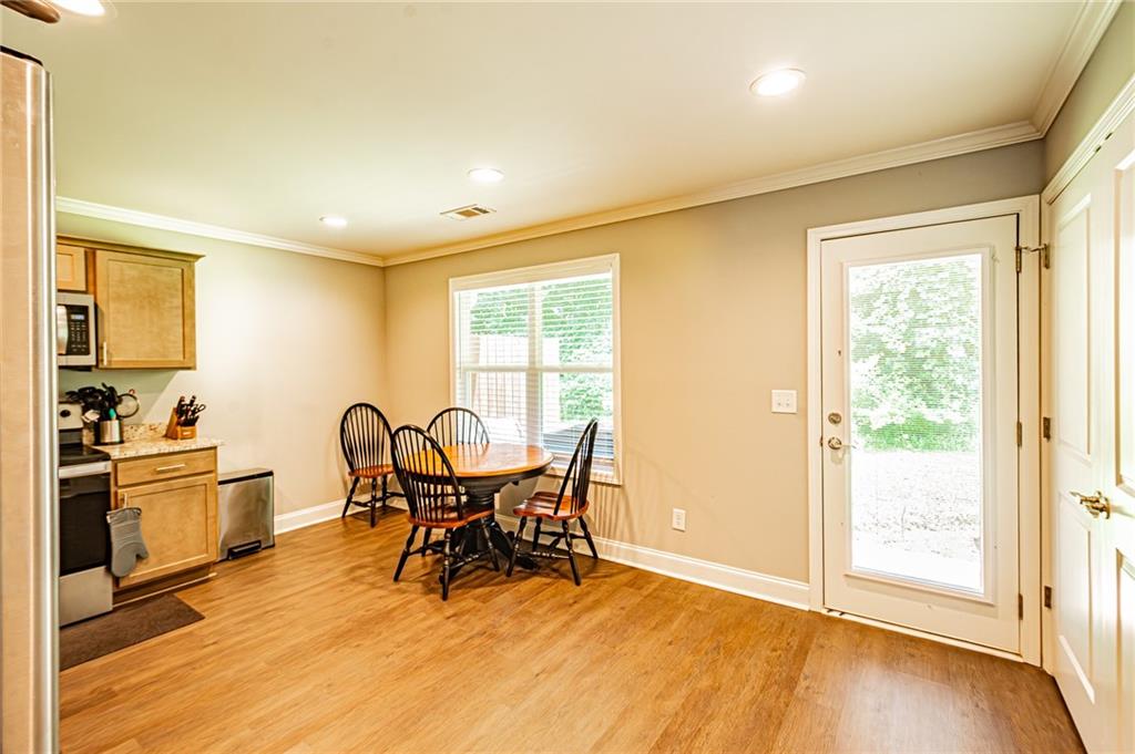 502 Wimpy Mill Road Dahlonega, GA 30533 - Photo 8 of 30 a view of a dining room with furniture and a window