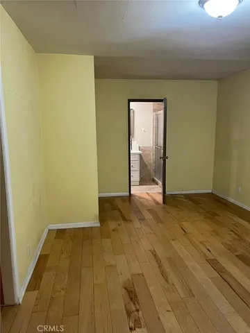 a bathroom with a granite countertop sink a mirror and shower