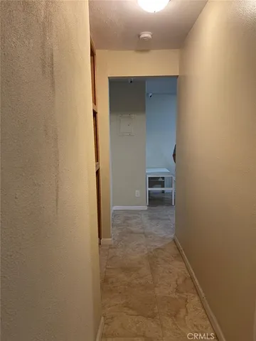 a kitchen with a refrigerator and a stove