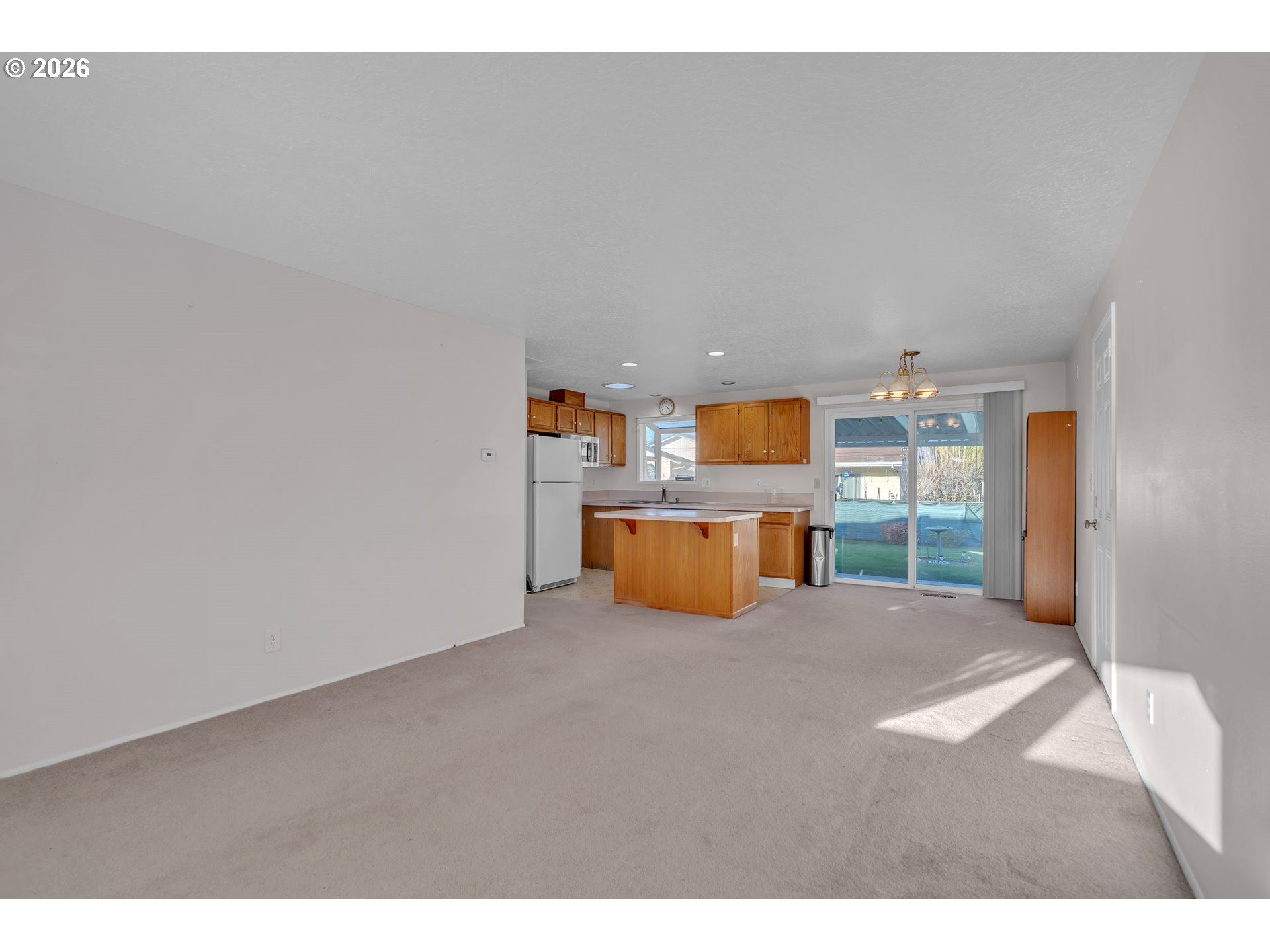 1379 Sallal Road Woodburn, OR 97071 - Photo 11 of 24 a view of an empty room with a kitchen