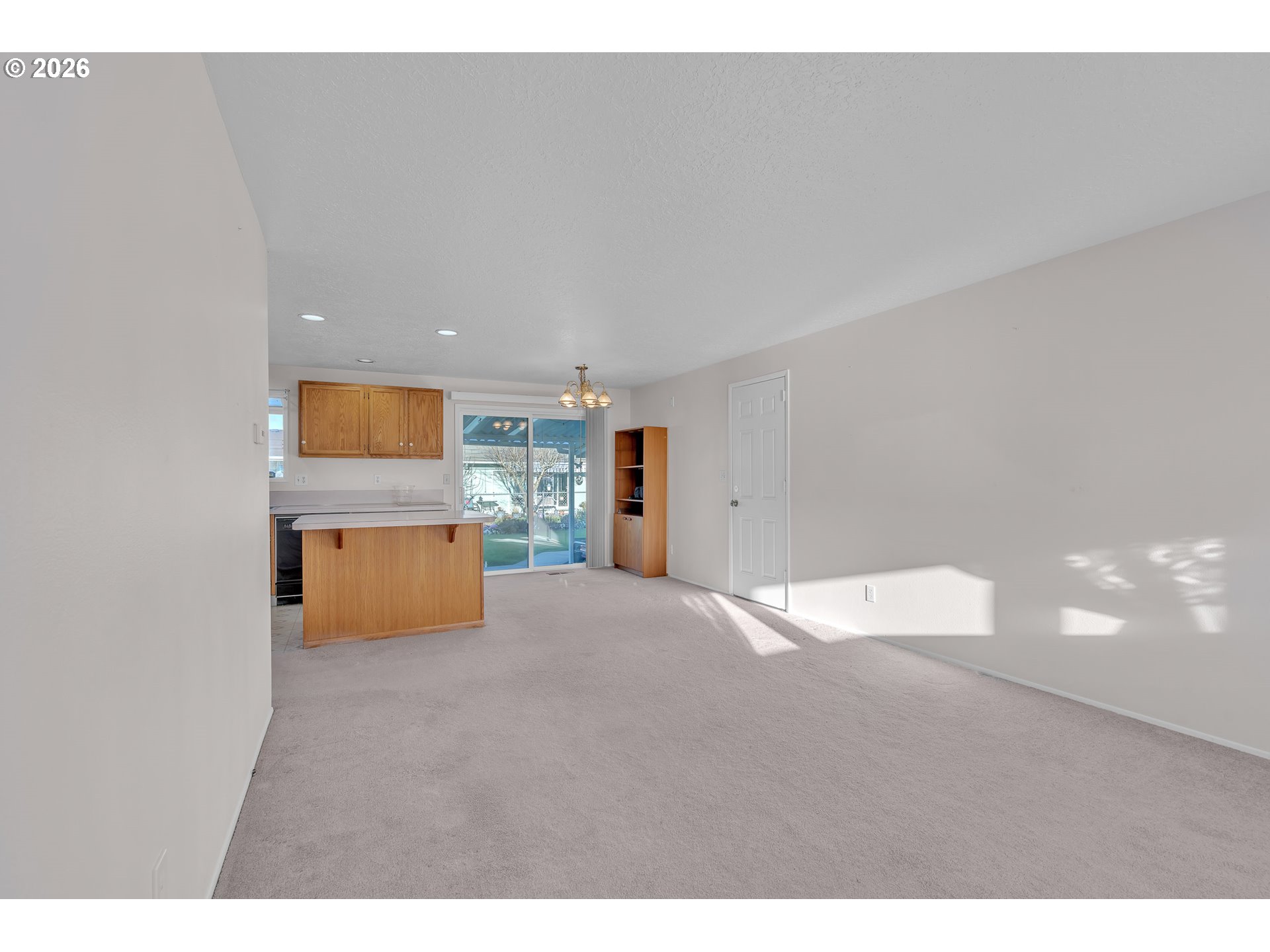 1379 Sallal Road Woodburn, OR 97071 - Photo 12 of 24 a view of a big room with wooden floor