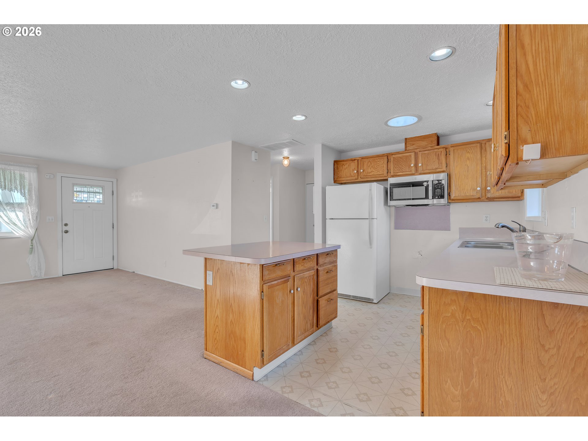 1379 Sallal Road Woodburn, OR 97071 - Photo 9 of 24 a kitchen with stainless steel appliances granite countertop a sink refrigerator and cabinets