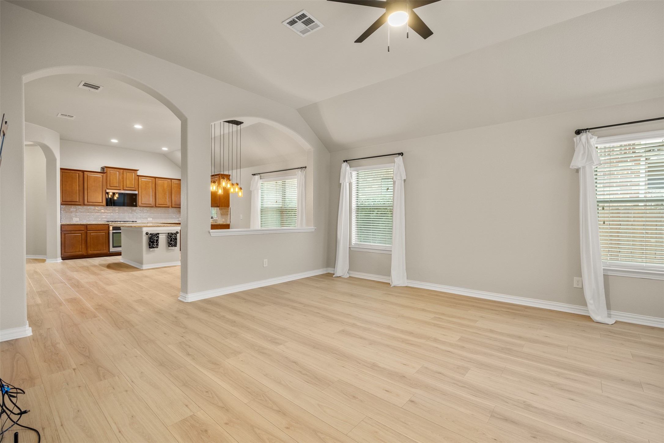 249 Saffron Springs Buda, TX 78610 - Photo 12 of 21 a view of an empty room with a kitchen