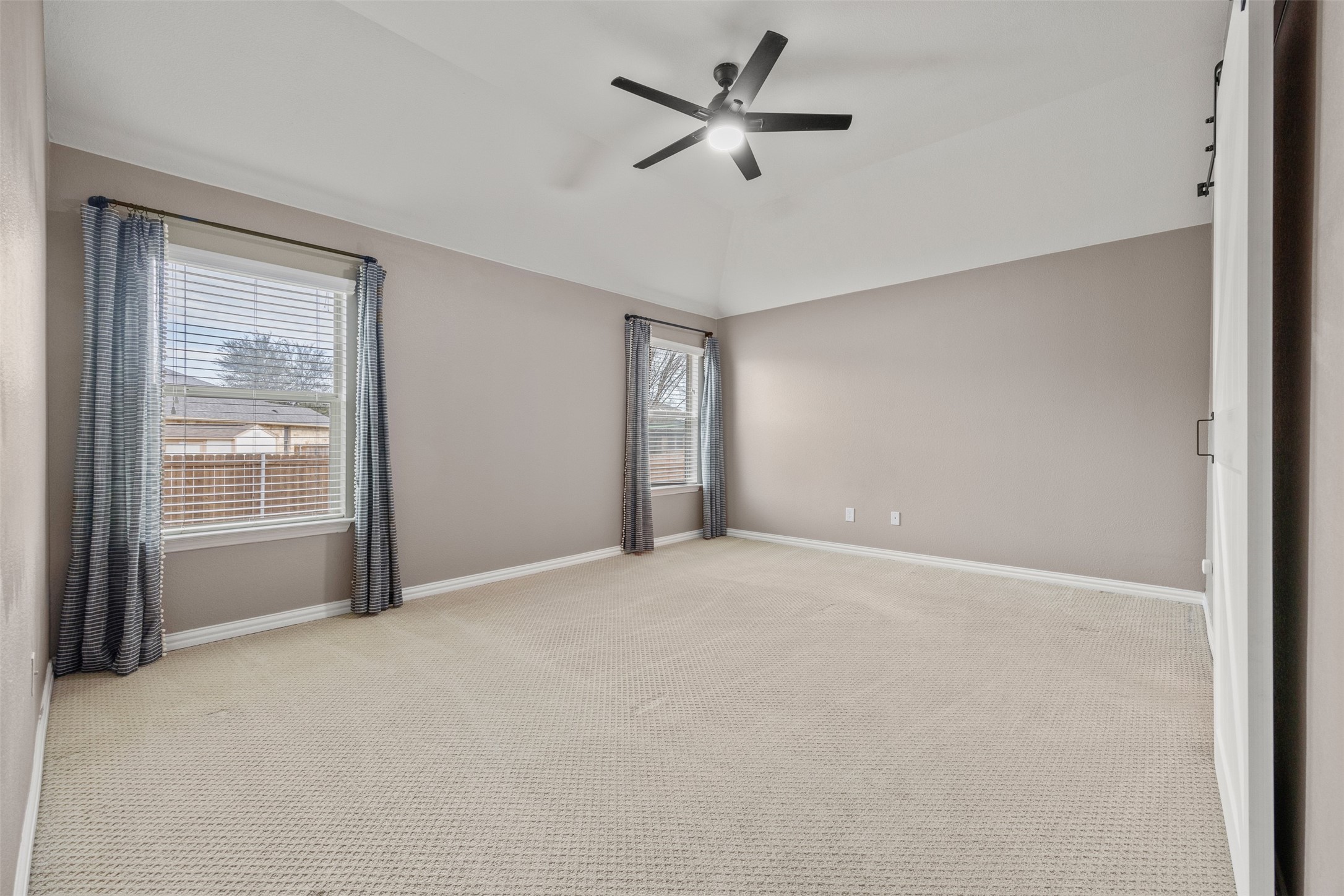 249 Saffron Springs Buda, TX 78610 - Photo 14 of 21 a view of an empty room with a window