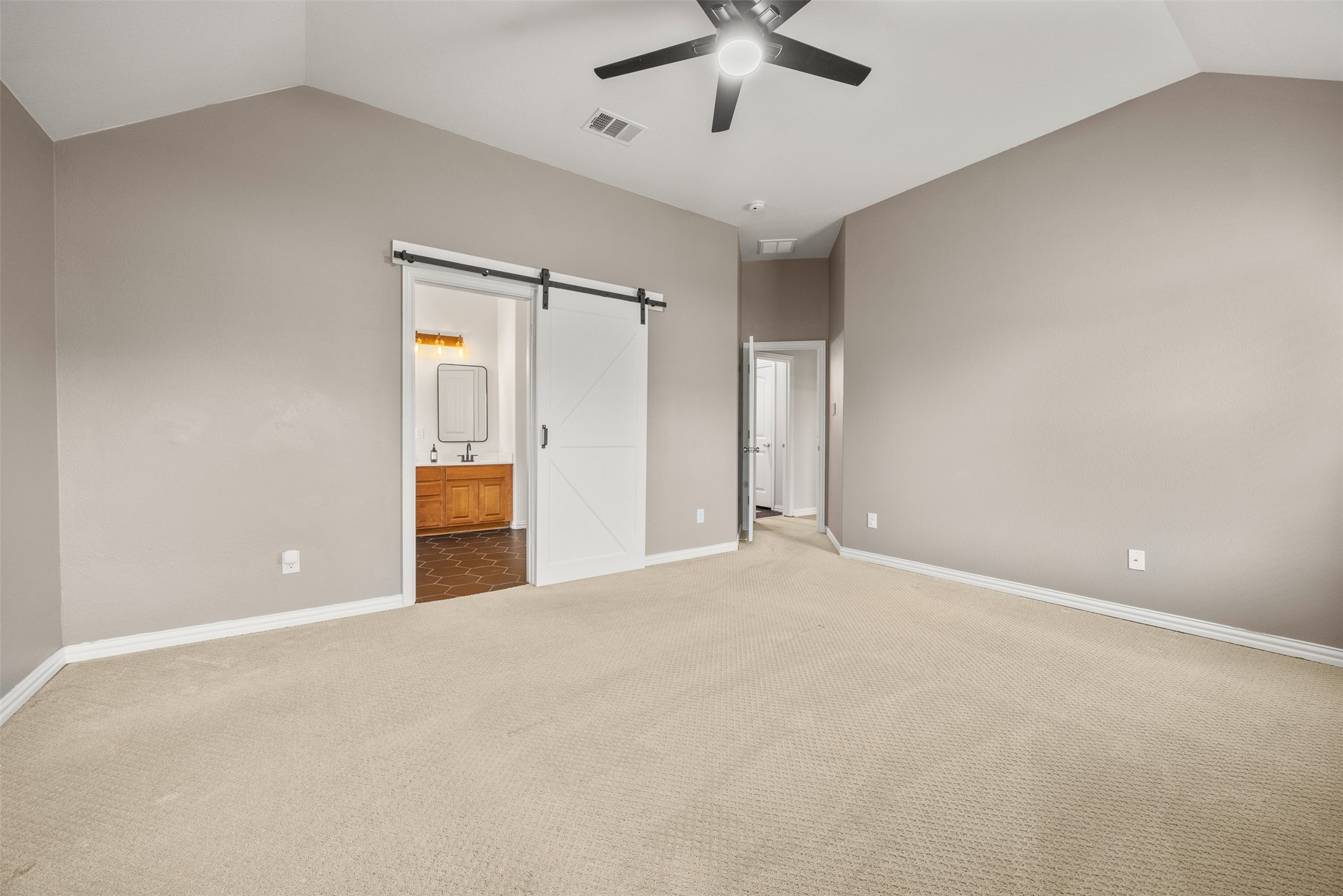 249 Saffron Springs Buda, TX 78610 - Photo 15 of 21 an empty room with a ceiling fan and a window