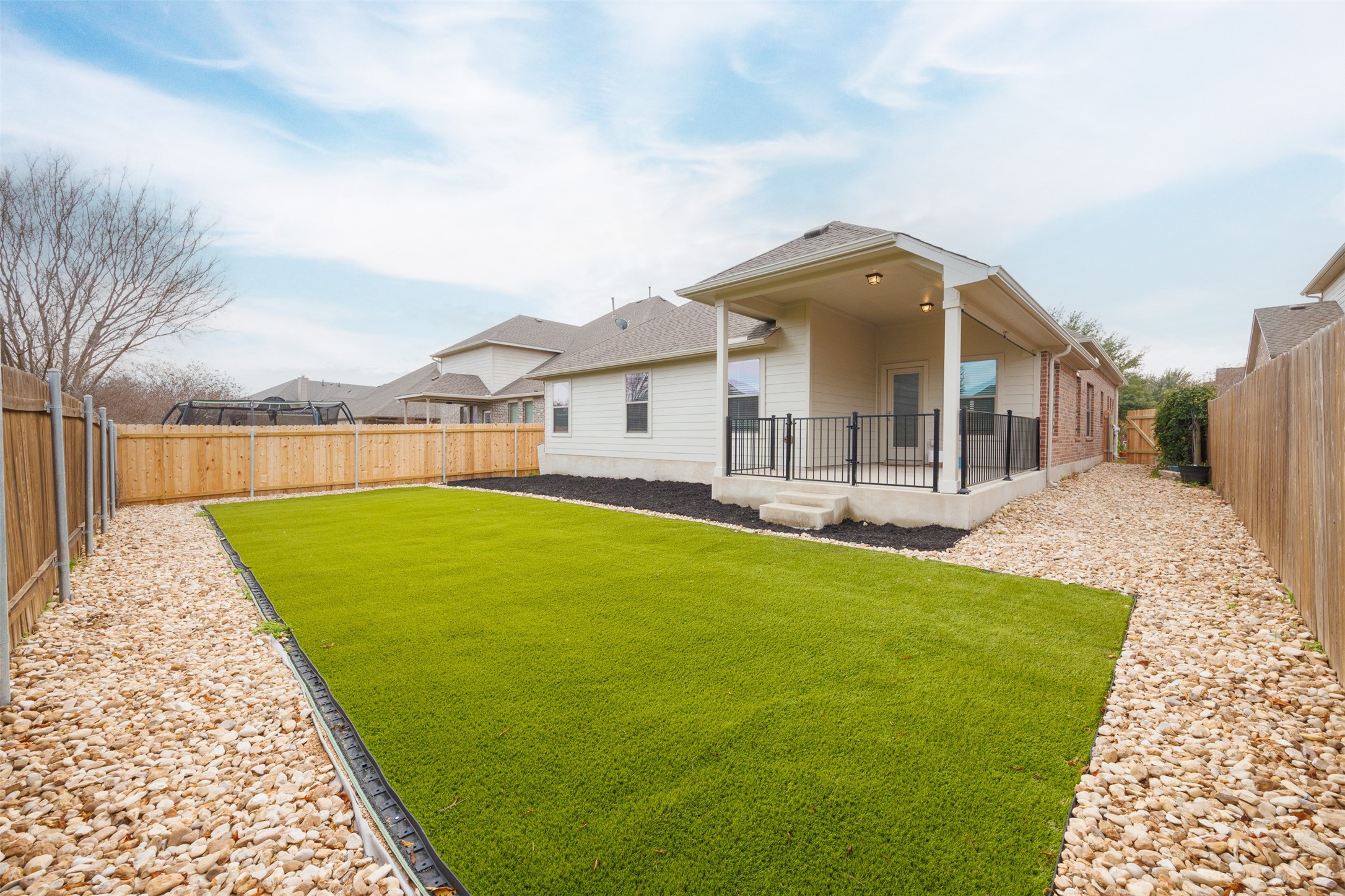 249 Saffron Springs Buda, TX 78610 - Photo 4 of 21 a view of outdoor space yard and swimming pool