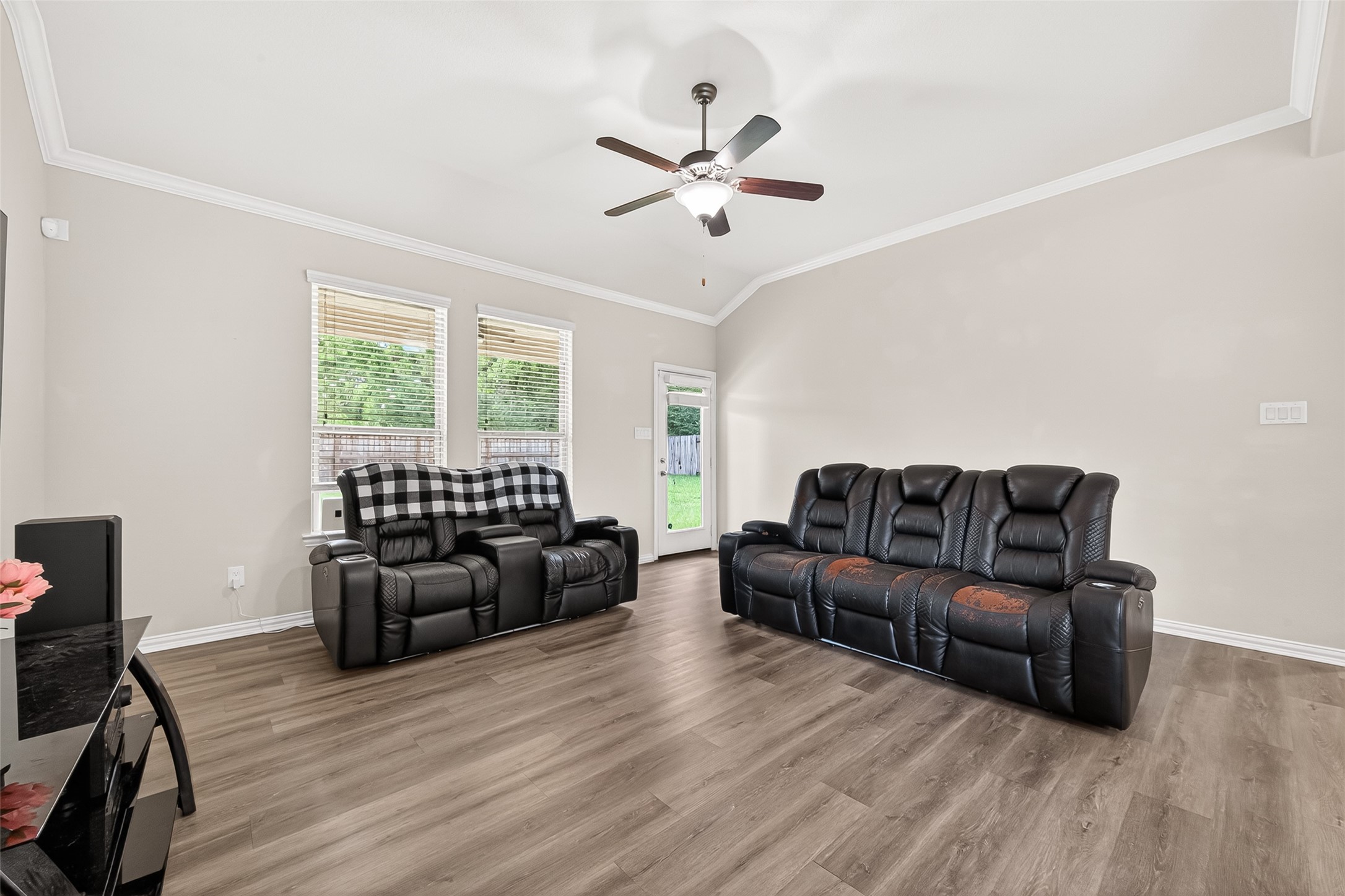 8 Landscape Court Conroe, TX 77301 - Photo 9 of 43 a living room with furniture and a large window