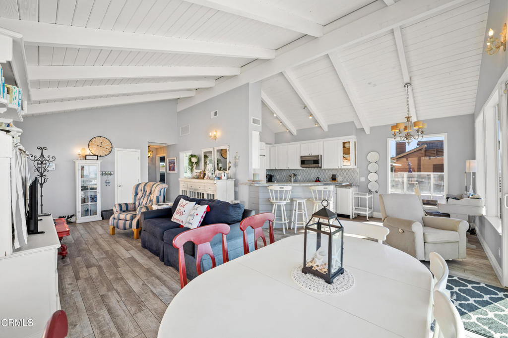 2405 Ocean Drive Oxnard, CA 93035 - Photo 19 of 40 a living room with lots of white furniture and a table