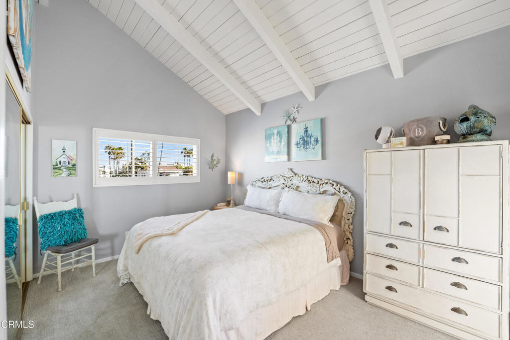 2405 Ocean Drive Oxnard, CA 93035 - Photo 22 of 40 a bedroom with a bed and a painting on the wall