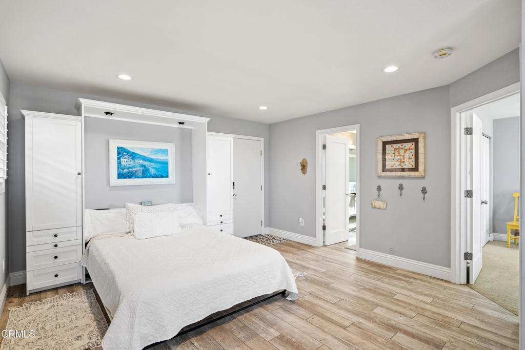 2405 Ocean Drive Oxnard, CA 93035 - Photo 29 of 40 a bedroom with a bed and painting on the wall