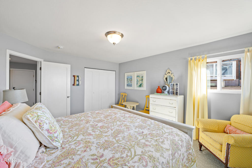 2405 Ocean Drive Oxnard, CA 93035 - Photo 32 of 40 a bedroom with a large bed and a couch