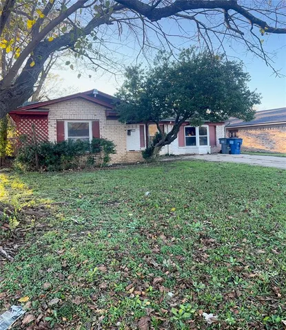 a front view of a house with yard