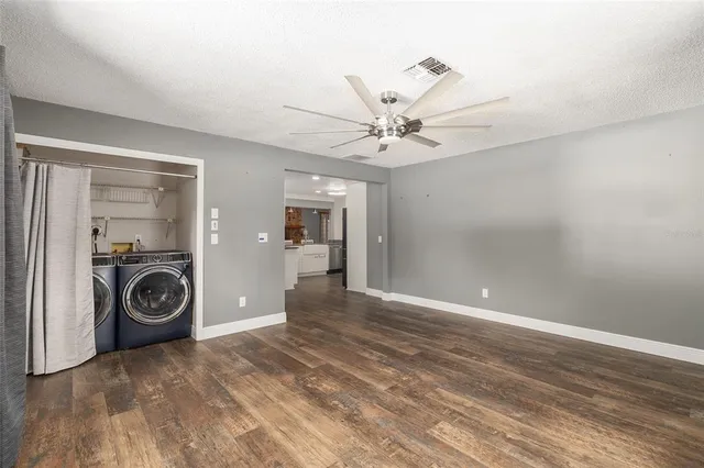 a view of a livingroom with a washer and dryer