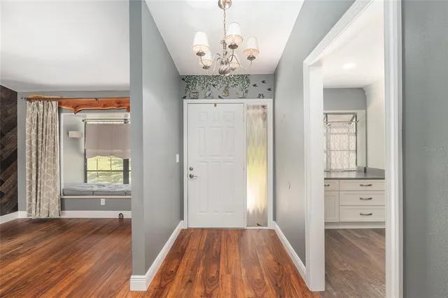 wooden floor in an empty room and a window