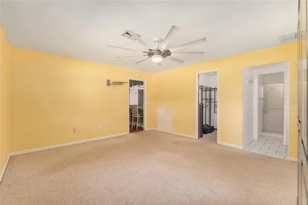 a view of a bedroom with furniture and windows